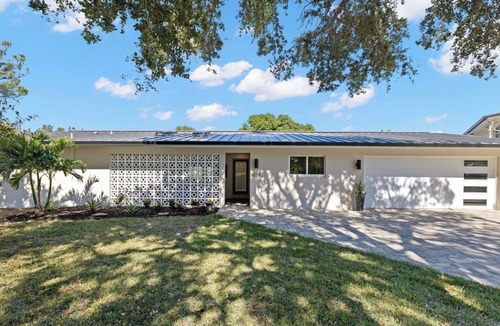 Cocoa Isles House | Luxury Waterfront Retreat Bikes, Hot Tub, Kayak, Walk to downtown Cocoa Beach.