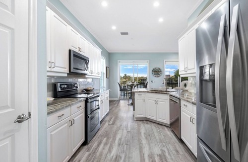 Miromar Lakes Condo | Luxury Waterfront Rental with wraparound water views at Miromar Lakes,