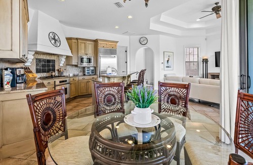 St. Tropez House | Mediterranean-style home with pool & hot tub access, W/D, AC & golf cart