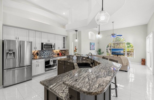Melbourne Beach House | Melbourne Beach Oasis Home W/Ground‑Floor Patio, Heated Pool, Lanai & Backyard Retreat 🌴🌊