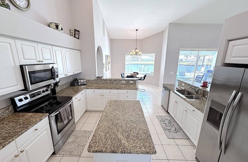 Pelican House | Michaela 1059 Gulf Access 3BR Heated Pool/Spa and Large Dock with Tiki, Kayaks Included