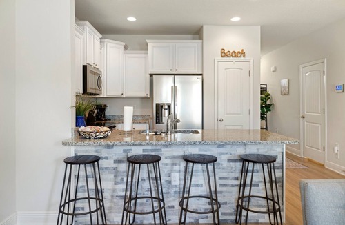 Thomas Drive House | Modern 3BR Townhome | Pool Access | Near Publix Sports Park & Beaches | Sleeps 9