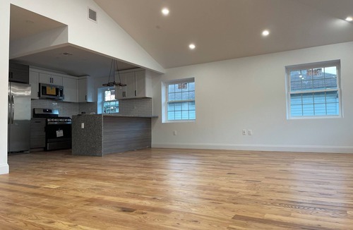 Queens House | Modern 4-bedroom townhome in lovely Jamaica with cool AC