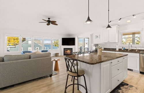 Beulah House | Modern-coastal retreat with lake views, covered deck, and walkable downtown Beulah location.