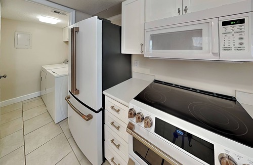 Butler Beach Condo | Modern First-floor Condo with Pool, Porch, Beach Access.