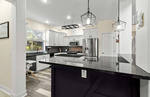 Port Richey House | Modern Spacious Getaway: Heated Pool, Movie Room, Huge Yard & Event-Friendly in New Port Richey, Florida