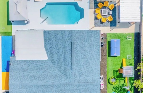 Largo House | Outdoor Movie Oasis Heated Pool Spa Game Room