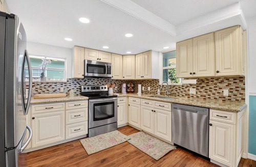 Parrot Cove House | Palm Beach Pool Oasis Walk to Golf, Beach, and the Ave