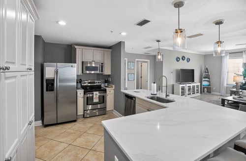 Upper Grand Lagoon Condo | Panoramic Stylish Gulf Retreat w/Epic Pool Area