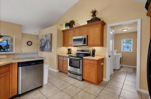 White Marsh House | Paradise Found - Enjoy sunny afternoons in this beautifully decorated pool home
