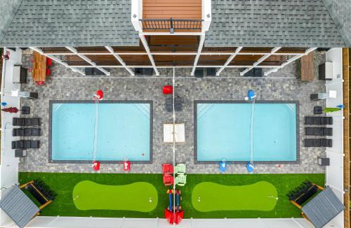 Lower Grand Lagoon Apartment | PCB Sleeps 22! 2 Homes, 2 Pools, 2 Mini Golf
