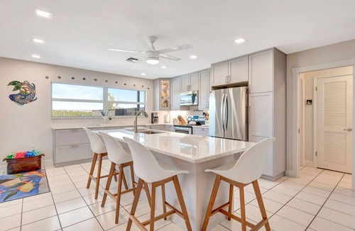 Bay Harbor Estates House | Pet-Friendly Canal Pool Home & Boat Dock