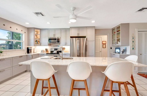 Bay Harbor Estates House | Pet-Friendly Canal Pool Home & Boat Dock