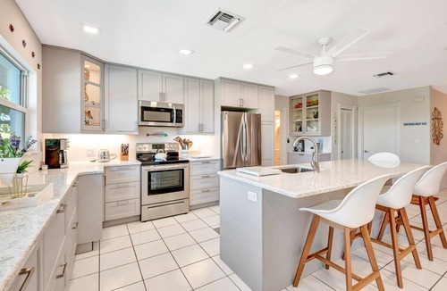 Bay Harbor Estates House | Pet-Friendly Canal Pool Home & Boat Dock