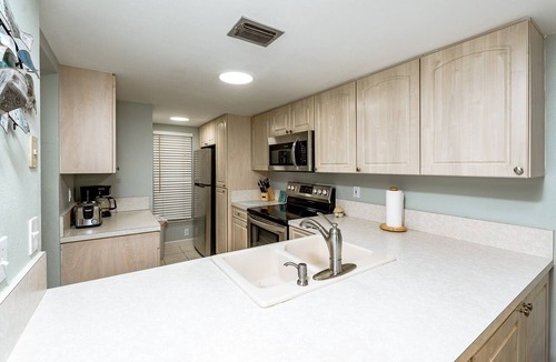 Point East Condo | Point East 107 Ground Floor Walk out To Pool No Drive Beach