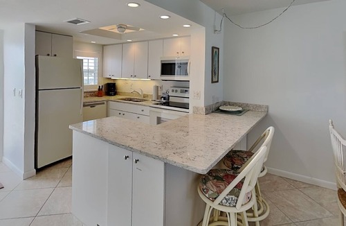 Mid Island Condo | Pointe South 403 | Stunning Views and Pool