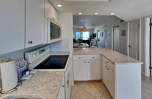 Mid Island Condo | Pointe South 403 | Stunning Views and Pool