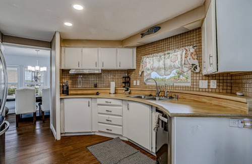 Goodland House | Private Dock, Boats & Bikes Charming Canal-Side Condo w/Screened Porch