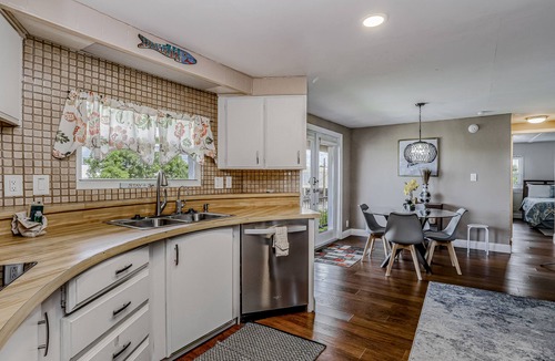 Goodland House | Private Dock, Boats & Bikes Charming Canal-Side Condo w/Screened Porch