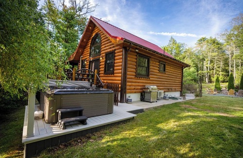 Yulan House | Private log cabin nestled at the base of a secluded wooded area