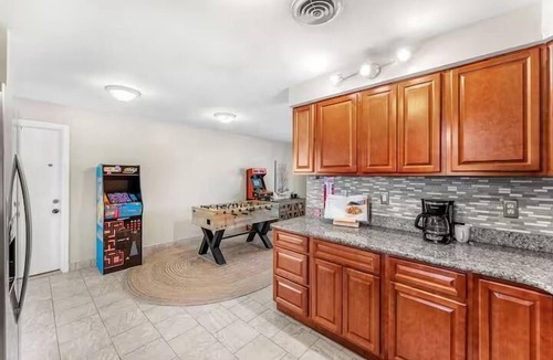 Cocoa Isles House | Private Pool + Hot Tub + Outdoor Movie Nights — Relax in your own backyard oasis with a heated pool, spa, fire pit, and fire up the projector under the stars. Located in famous Cocoa Beach near Kennedy Space Center, Disney & Port Canaveral!