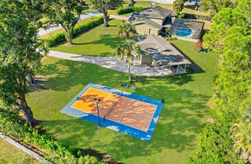 Westchase House | Private Pool Pickleball Game Room Sleeps 18