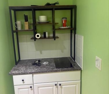 Pinellas Park House | Private suite with small kitchen private bathroom entrance porch and driveway