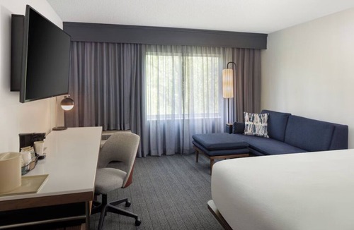 Hopelawn Hotel | Relax in Modern Room with 1 King Bed, Free Parking, Easy Highway Access