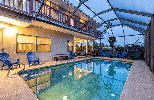 Satellite Beach House | SAND CASTLE: Big beach house. Walk to Beach. Heated Pool in screened pool house.