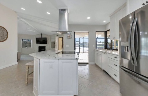 Punta Gorda House | SENSATIONAL! WATER-VIEW, LUXURY REMODEL, SUNNY HEATED POOL, HUGE 145’ SEA WALL