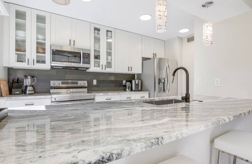 Hunt Club Condo | Serene Water-View Retreat with Wraparound Lanai & Elegant Renovations