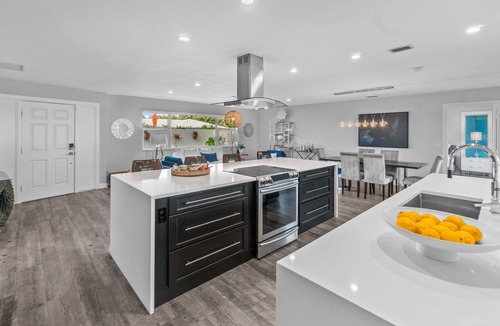 Singer Island Villa | Seven Palms Waterfront - Private Dock, Heated Pool & Lanai - Walk to Beach!