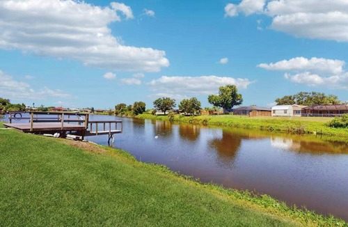 Englewood East House | Snowbird-friendly home with private pool, water views, patio & sunroom