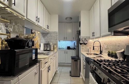 East Harlem Apartment | Spacious 4-bedroom apartment by Central Park North with fire place and gym
