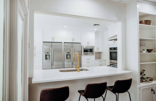 Gunter Afs House | Spacious 7BR home featuring a private pool, separate pool house, game room, Peloton-equipped workout sunroom, dedicated office, multiple living areas, and a fully equipped kitchen—perfect for families, groups, and extended stays.