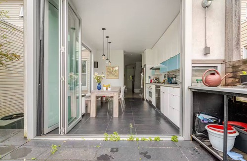Kensington House | Spacious, artful 4-bedroom house in Brooklyn with lush backyard, parking, A/C