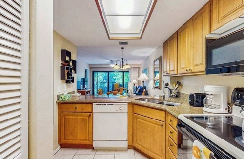 Park Shore Condo | Spacious, waterfront condo with outdoor pool, tennis, & volleyball