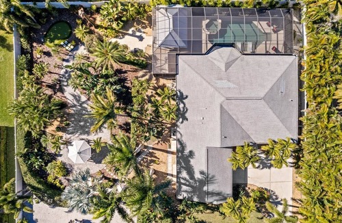 Palma Sola House | Stuck on 'Cation: Pool, Spa, Outdoor Kitchen, Screened Lanai by Anna Maria Life Vacation Rentals