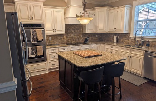 Evans House | Stunning 4-Bedroom Retreat with Resort-Style Backyard in charming Evans.
