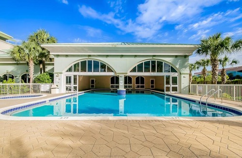 Miramar Beach House | Sunny oceanfront condo with two shared pools hot tub - walk to the beach