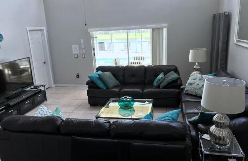 Lake Berkley Villa | Sunny South Facing Pool with Hot Tub and Lake View Near Disney