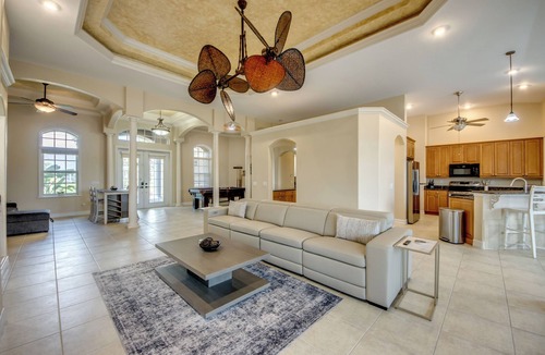 Fort Myers Villa | The Grand Colonnade - Ample 3 BR/3 bath waterfront Villa with 2 suites, heated pool, kayaks, pool table, fishing poles