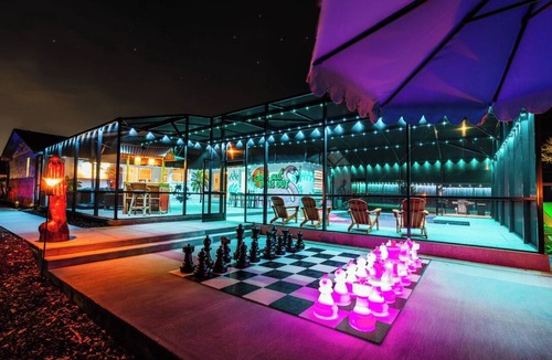 Longwood House | The Tiki Palm- Screened Pool, Mini Golf, Arcade & Creekside Fun