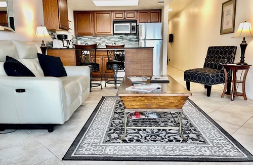 Vanderbilt Beach Condo | TOP FLOOR BAY VIEW, ROOFTOP POOL, STEPS TO VANDERBILT BEACH!