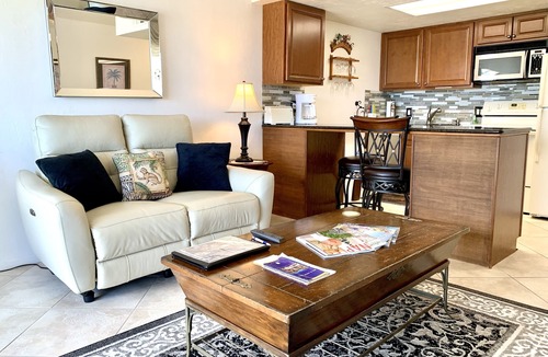 Vanderbilt Beach Condo | TOP FLOOR BAY VIEW, ROOFTOP POOL, STEPS TO VANDERBILT BEACH!