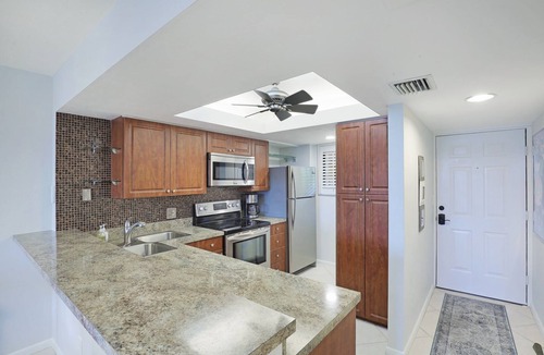 Bonita Bay Condo | 🌿Tranquil 2/2 Seasonal Getaway with Lake Views in Wild Pines in Bonita Bay! 🌊"