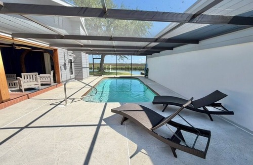 Spring Hill House | Tranquil Canal-Front Home with Direct Gulf Access and Stunning Sunsets