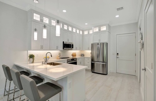 Stuart House | Tranquil Waters New Waterfront Townhome - Boat slip with lift included.