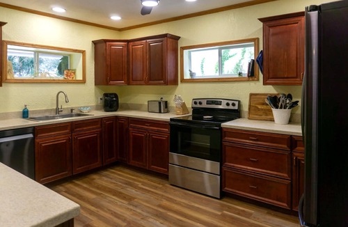 St. Lucie Village House | Tropical Pool Retreat + Walk to River + Pet Friendly