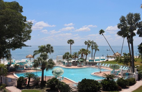 Pinellas Point House | Tropical Retreat: Outdoor Pools, Private Beach, Waterfront Dining
